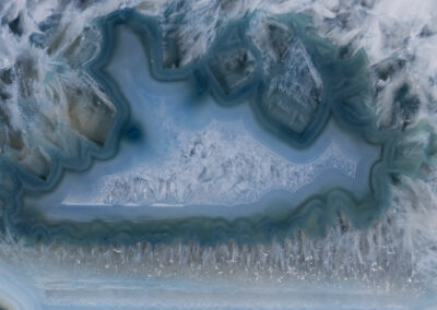 Icelike crystals within a larger blue cavelike matrix