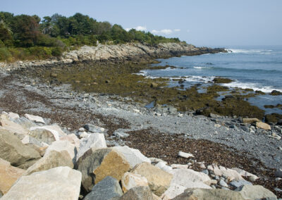 An shoreline area of rocks and gravel in Maine