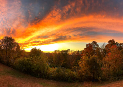 A dramatic arcing sunset over a valley in Connecticut
