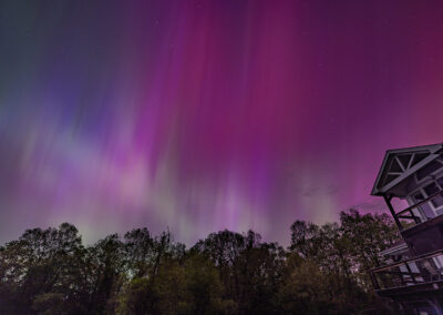 A magenta aurora in the sky over the photographer's Carlin Hill home