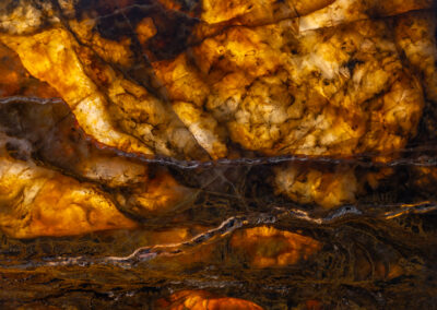 A moody shot of veins and crystal formations in a mineral