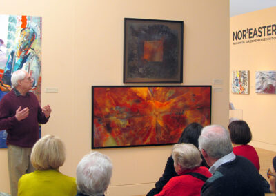 George Fellner discusses his photo at an art exhibit