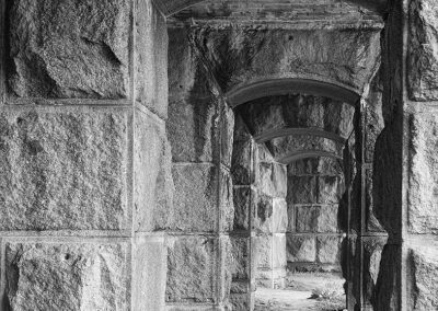 Black and white photo of hallways at Fort Popham, Maine