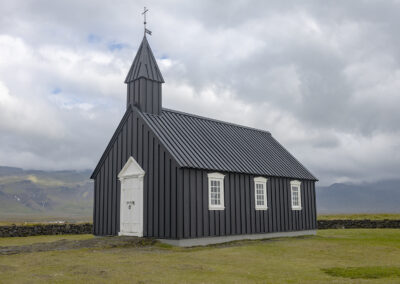 Black church in Búðir amid Icelandic countryside