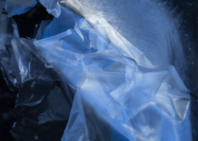 Blue and black patterns forming in a folded plastic liner
