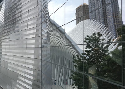 Photo of mirrored wall reflecting New York architecture