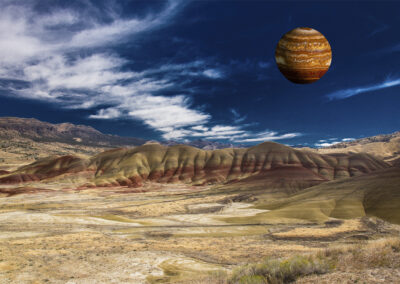 Photo composition with eroded hilly landscape and a floating orb with striped minerals