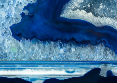 Light blue crystals on a deep blue background