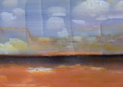 Minerals form an impressionist scene with cloudy blue sky and orange landscape with a hint of cliffs