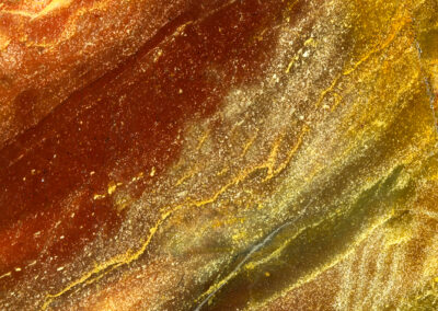Rust and dark olive background with yellow veins running through