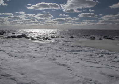 A cloud-strewn sky over Hammonassett Beach in Madison, Connecticut