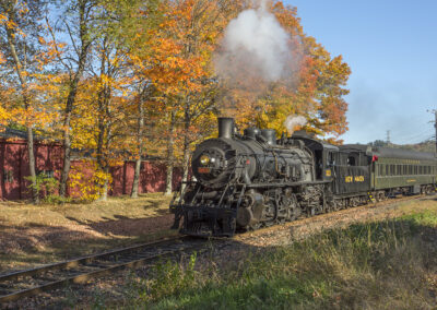 The Essex Steam Train travels through Connecticut fall foliage