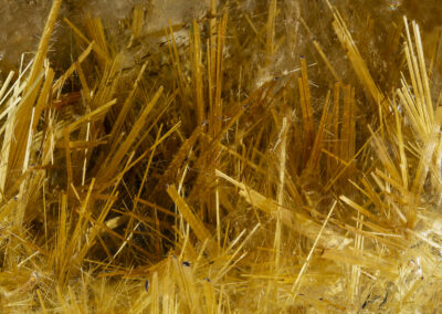 Latticelike yellow and brown mineral formations resembling hay or straw