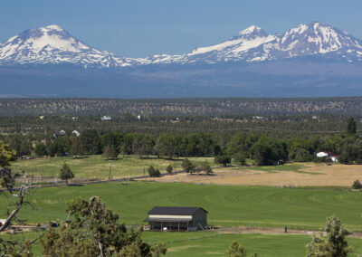 Landscape photo of snowy mountains overlooking an Oregon valley