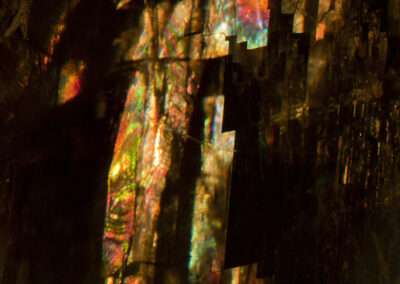 Iridescent highlights resembling a tall structure on a black background