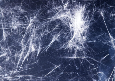 A dark blue mineral matrix shot through with sparklike white patterns