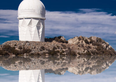 Photo composition of an observatory-like structure that seems to float on a rock island in the sky
