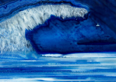 White crystals and blue mineral layers form an icy landscape