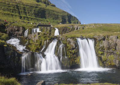 Kirkjufellsfoss waterfall and the grassy countryside