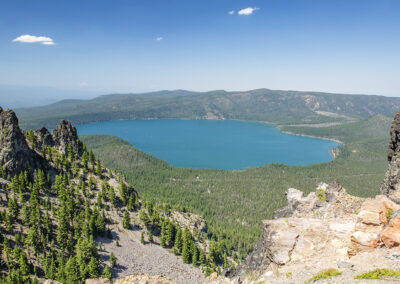 Landscape photo with rocky crags flanking a blue lake