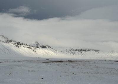 A snowy scene with hills at Búðir in Iceland