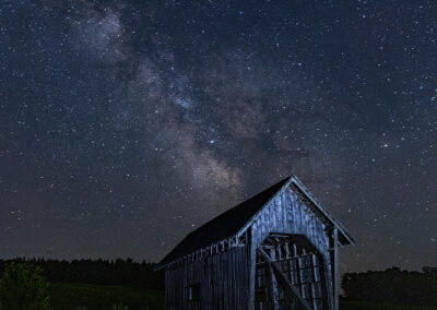 Night shot of the starfield over a covered bridge in Cabot, Vermont