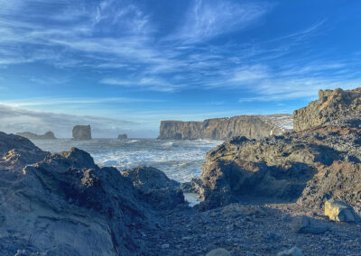 Shoreline with ocean and rocky outcrops