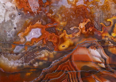 Orange and red layers in a cracked mineral formation