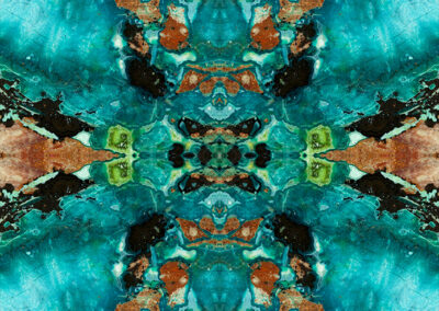 Reflected aqua, orange, green and black minerals resemble a quilt pattern