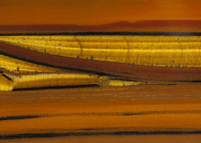 Gold, orange and brown layers resemble a desert landscape