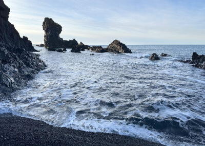 Seascape at an Iceland beach with rocky promontories
