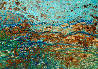 Stippled mineral patterns in cyan, green and copper with blue veins throughout