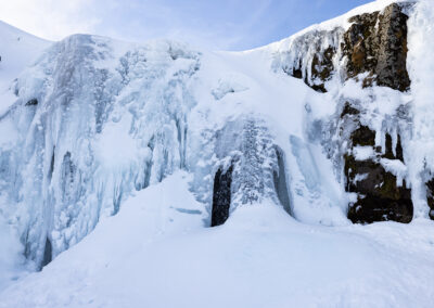 A frozen Kirkjufellsfoss waterfall in Iceland