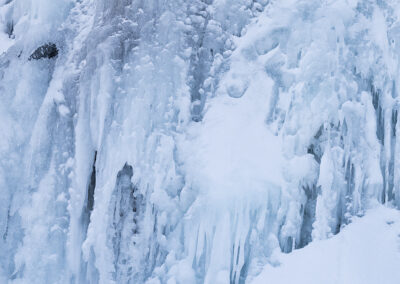 A frozen Kirkjufellsfoss waterfall in Iceland