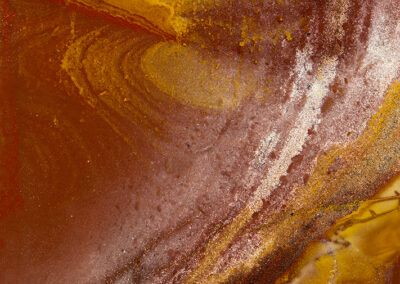 A swooping form runs through a rust and yellow background