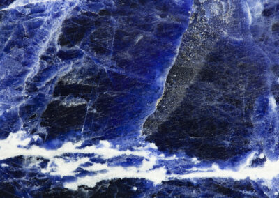 Royal blue mineral patterns form a seascape
