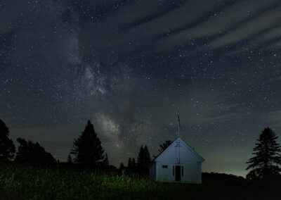 Night shot of the starfield over a building in Cabot, Vermont