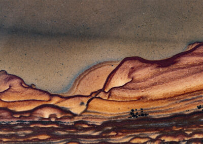 Mineral patterns in tan, orange and brown resembling a landscape
