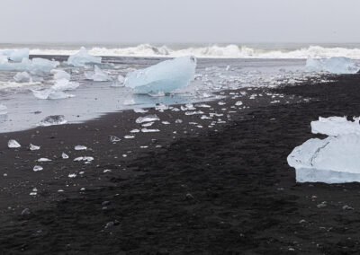 Black sand and sculputural ice at Diamond Beach in Iceland