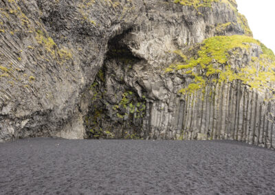 Basalt columns and black beach sand at Reynisfjara, Iceland