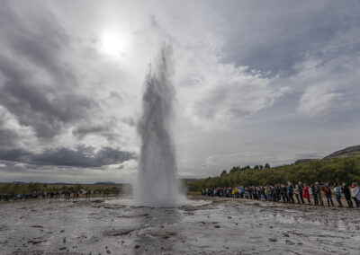 A geyser erupts at Geysir, Iceland