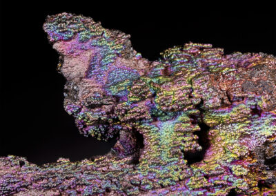 Iridescent nodules on a black background