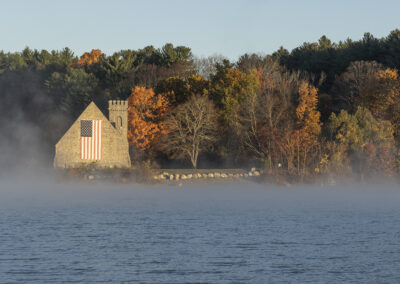 Misty photo of old waterfront stone church in Massachusetts