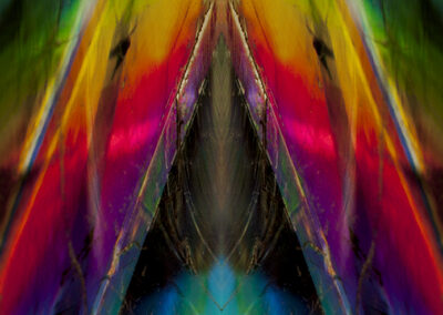 Iridescent rainbow triangular crystalline mineral structure