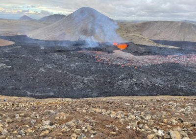 A volcanic landscape in Iceland with erupting caldera