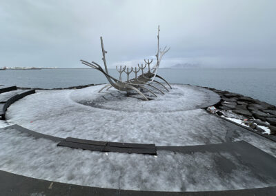 Icelandic seascape with metal boat sculpture