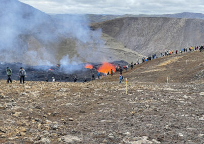 Visitors explore a volcanic landscape at Fagradalsfjall