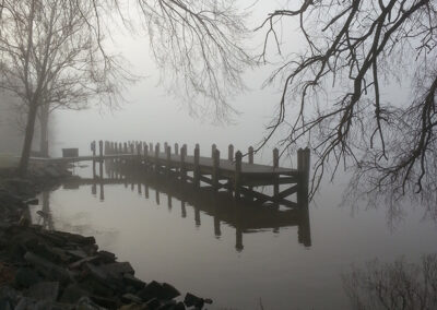 A dock lies in fog on the Connecticut River