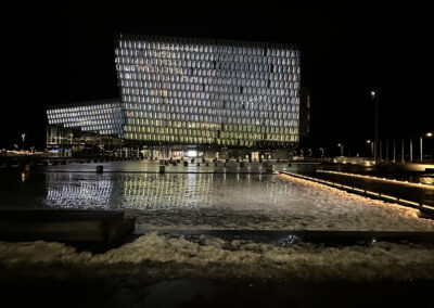 An exterior night shot of the Harpa concert hall