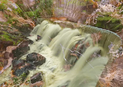 A waterfall overlaid with a petrified wood texture